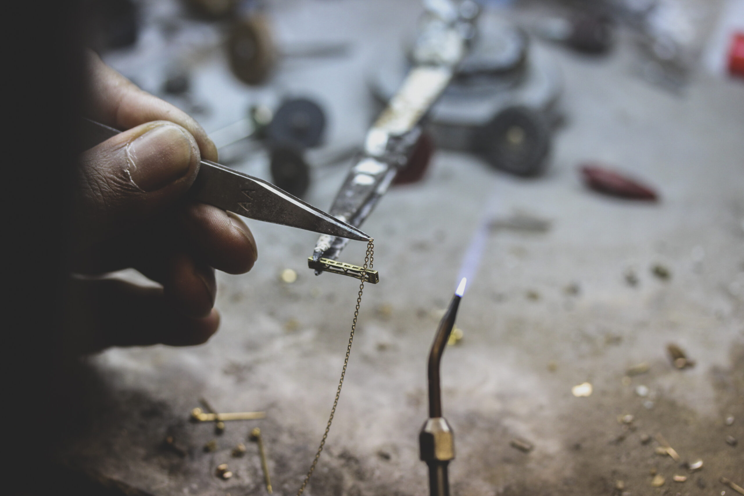 jeweler-performing-repair-on-metal-jewelry